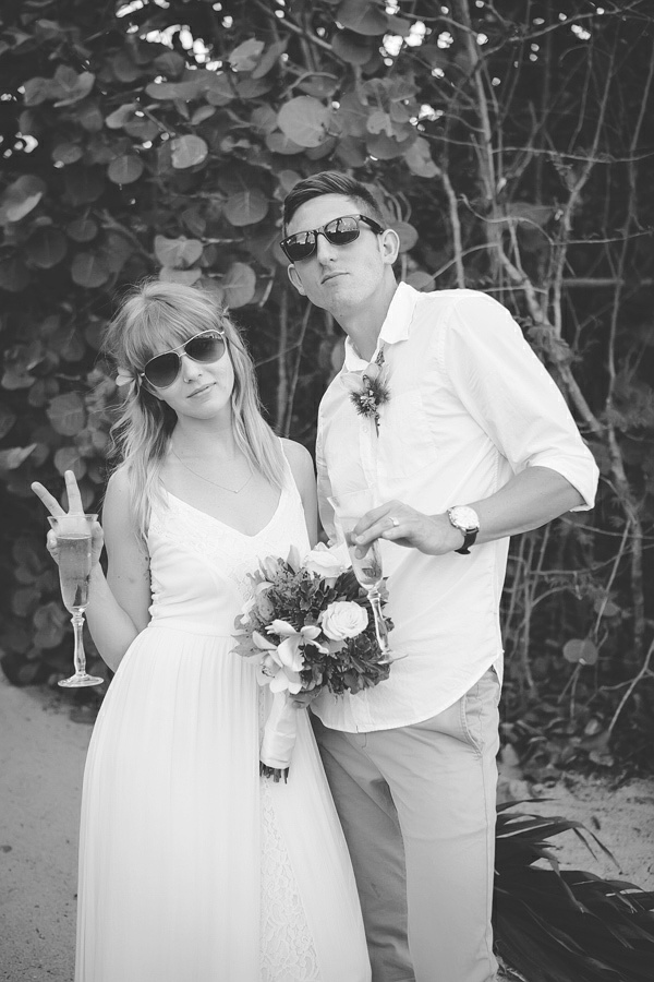 St. Croix bride and groom wearing sunglasses giving the peace sign
