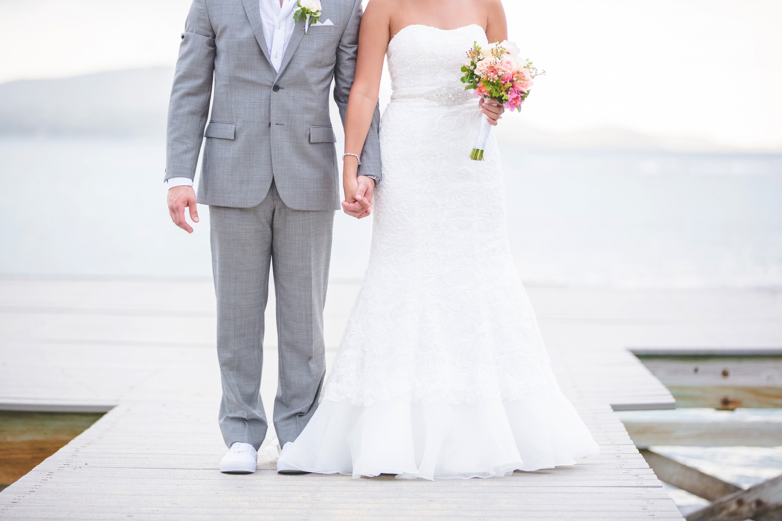 St. Croix wedding couple staying on dock holding hands