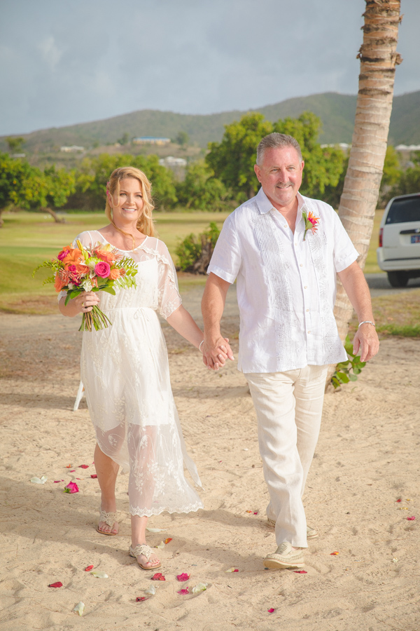St. Croix bride and groom walking down the aisle on beach