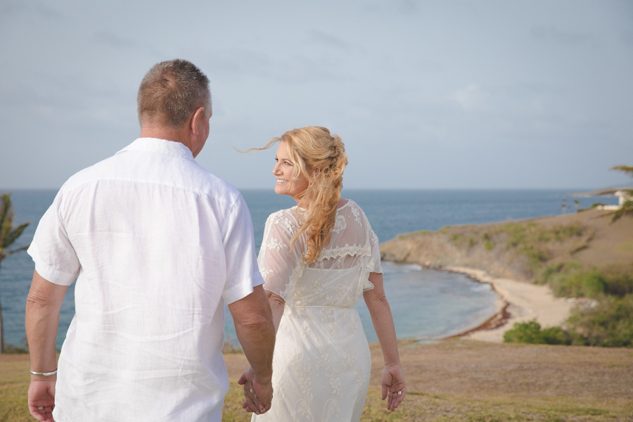 St. Croix bride leading groom on hillside