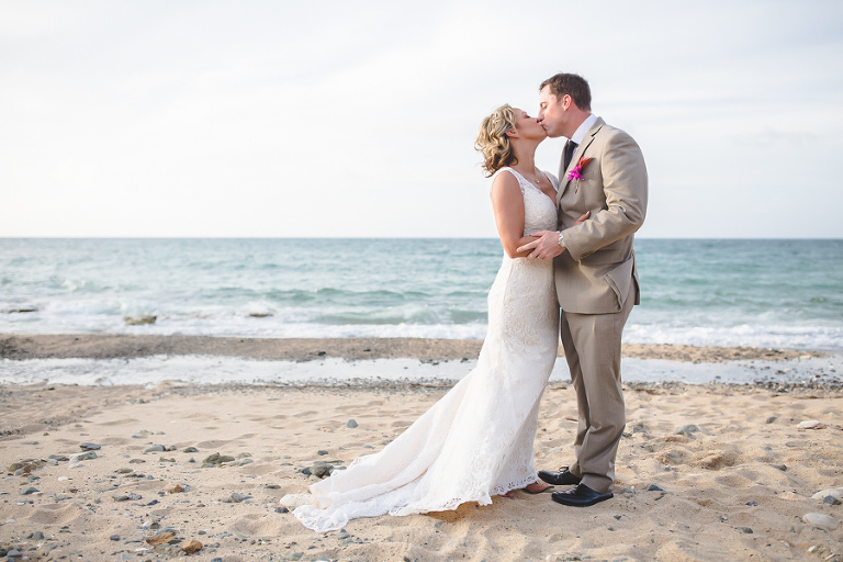 St. Croix bride and groom kissing on the beach