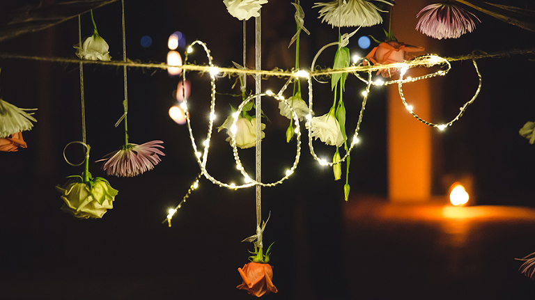 St. Croix wedding sign that spells the word love with Christmas lights decorated with flowers