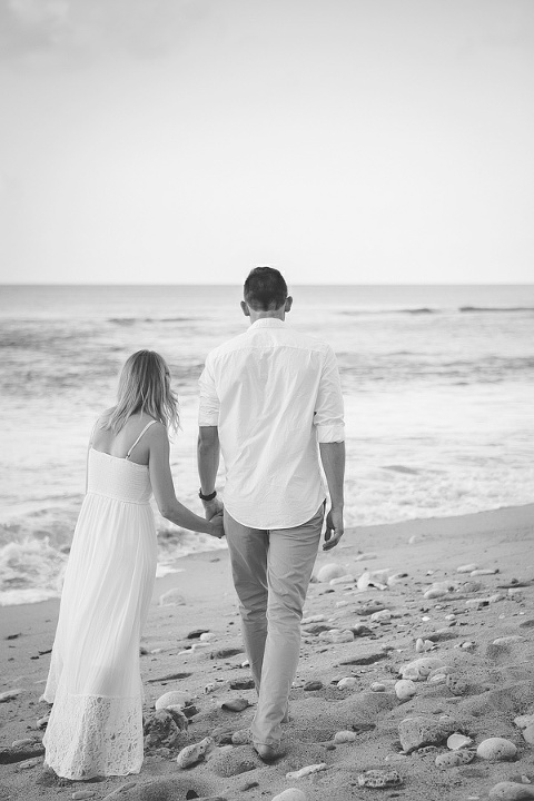 black and white image of St. Croix bride and groom walking down the beach